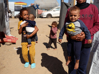 Displaced Palestinians are seen in a temporary camp in Khan Yunis, Gaza Strip, on October 20, 2024, amid the ongoing war in the Palestinian...