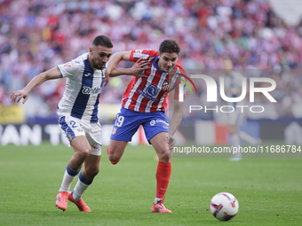 Julian Alvarez of Atletico de Madrid and Munir El Haddadi of Leganes fight for the ball during the La Liga 2024/25 match between Atletico de...