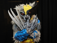 A cosplayer dressed as a werewolf and Wolverine combo poses for a photo during New York Comic Con at the Javits Center in New York City, on...