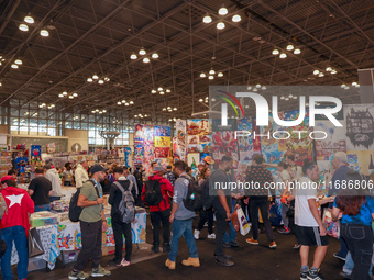 People attend the New York Comic Con 2024 at the Jacob Javits Center in New York City, United States, on October 19, 2024. New York Comic Co...