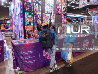 People attend the New York Comic Con 2024 at the Jacob Javits Center in New York City, United States, on October 19, 2024. New York Comic Co...