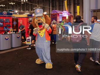 People attend the New York Comic Con 2024 at the Jacob Javits Center in New York City, United States, on October 19, 2024. New York Comic Co...