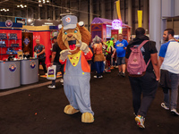 People attend the New York Comic Con 2024 at the Jacob Javits Center in New York City, United States, on October 19, 2024. New York Comic Co...