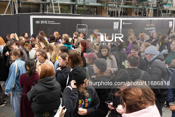 A hundred fans of former One Direction member Liam Payne gather to hold a memorial tribute at Dom Square following the death of the singer i...