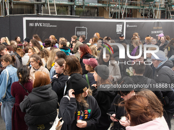 A hundred fans of former One Direction member Liam Payne gather to hold a memorial tribute at Dom Square following the death of the singer i...