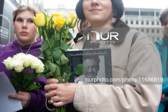 A hundred fans of former One Direction member Liam Payne gather to hold a memorial tribute at Dom Square following the death of the singer i...