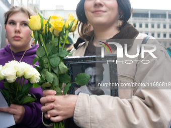 A hundred fans of former One Direction member Liam Payne gather to hold a memorial tribute at Dom Square following the death of the singer i...