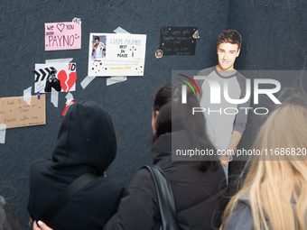 A hundred fans of former One Direction member Liam Payne gather to hold a memorial tribute at Dom Square following the death of the singer i...