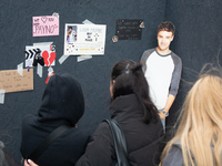 A hundred fans of former One Direction member Liam Payne gather to hold a memorial tribute at Dom Square following the death of the singer i...