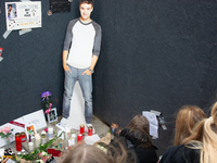 A hundred fans of former One Direction member Liam Payne gather to hold a memorial tribute at Dom Square following the death of the singer i...