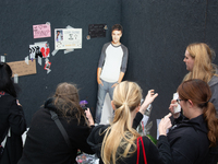 A hundred fans of former One Direction member Liam Payne gather to hold a memorial tribute at Dom Square following the death of the singer i...