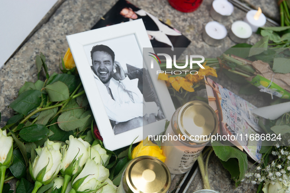 A hundred fans of former One Direction member Liam Payne gather to hold a memorial tribute at Dom Square following the death of the singer i...