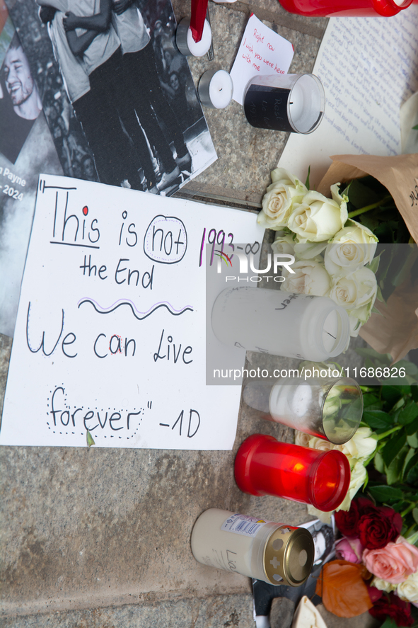 A hundred fans of former One Direction member Liam Payne gather to hold a memorial tribute at Dom Square following the death of the singer i...