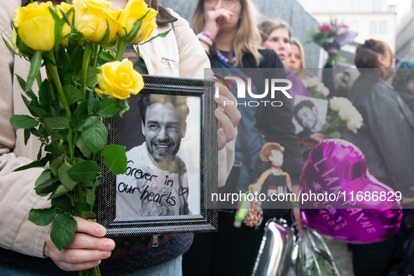 A hundred fans of former One Direction member Liam Payne gather to hold a memorial tribute at Dom Square following the death of the singer i...