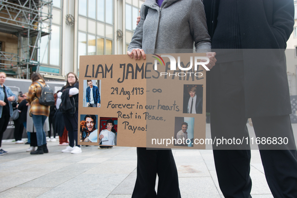 A hundred fans of former One Direction member Liam Payne gather to hold a memorial tribute at Dom Square following the death of the singer i...