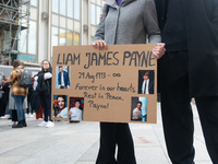 A hundred fans of former One Direction member Liam Payne gather to hold a memorial tribute at Dom Square following the death of the singer i...