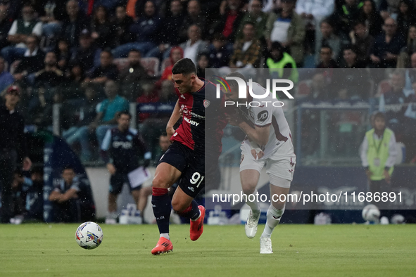 Roberto Piccoli (#91 Cagliari Calcio) and Sebastian Walukiewicz (Torino FC) participate in the Serie A TIM match between Cagliari Calcio and...