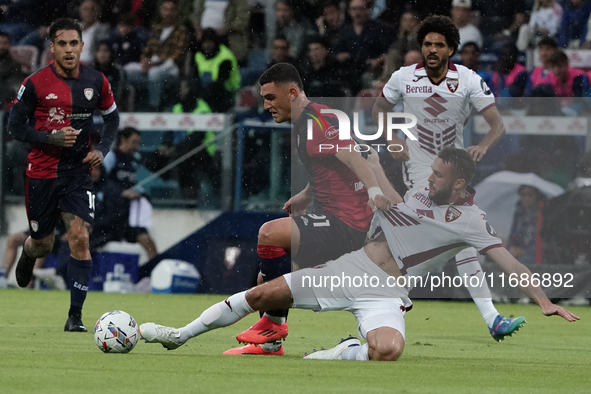 Roberto Piccoli (#91 Cagliari Calcio) and Sebastian Walukiewicz (Torino FC) participate in the Serie A TIM match between Cagliari Calcio and...