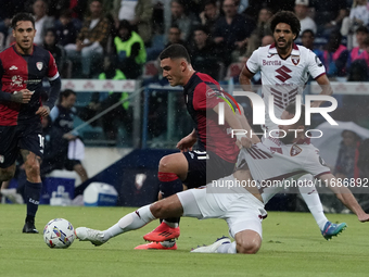 Roberto Piccoli (#91 Cagliari Calcio) and Sebastian Walukiewicz (Torino FC) participate in the Serie A TIM match between Cagliari Calcio and...