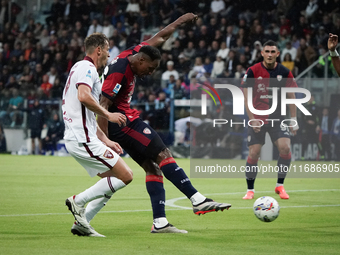 Yerry Mina (#26 Cagliari Calcio) and Antonio Sanabria (Torino FC) participate in the Serie A TIM match between Cagliari Calcio and Torino FC...