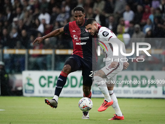 Yerry Mina (#26 Cagliari Calcio) and Antonio Sanabria (Torino FC) participate in the Serie A TIM match between Cagliari Calcio and Torino FC...