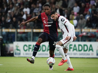 Yerry Mina (#26 Cagliari Calcio) and Antonio Sanabria (Torino FC) participate in the Serie A TIM match between Cagliari Calcio and Torino FC...