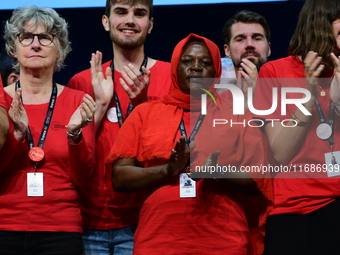 Volunteers participate in the closing night of the Lyon Light Festival in Lyon, France, on October 20, 2024. (