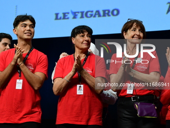 Volunteers participate in the closing night of the Lyon Light Festival in Lyon, France, on October 20, 2024. (