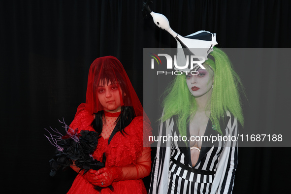 Manon and Jatabi from New York City dress as characters from Beetlejuice for New York Comic Con at the Javits Center in New York City, on Oc...