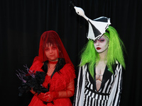 Manon and Jatabi from New York City dress as characters from Beetlejuice for New York Comic Con at the Javits Center in New York City, on Oc...