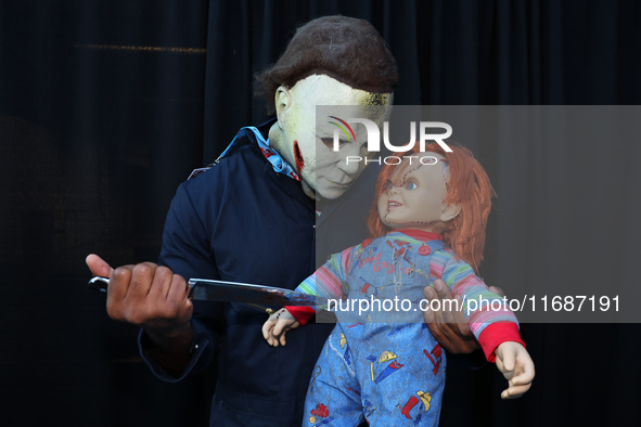 Cosplayer Michael Myers from Halloween holds a knife to Chucky for New York Comic Con at the Javits Center in New York City, on October 20,...