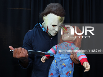 Cosplayer Michael Myers from Halloween holds a knife to Chucky for New York Comic Con at the Javits Center in New York City, on October 20,...