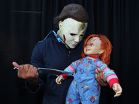 Cosplayer Michael Myers from Halloween holds a knife to Chucky for New York Comic Con at the Javits Center in New York City, on October 20,...