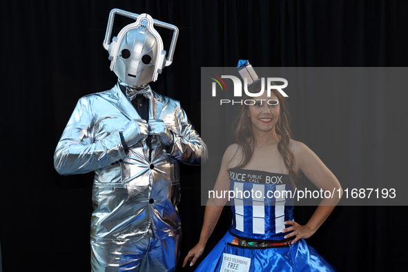 Joe and Lauren from Long Island dress as TARDIS and a Cyberman from Doctor Who for New York Comic Con at the Javits Center in New York City,...