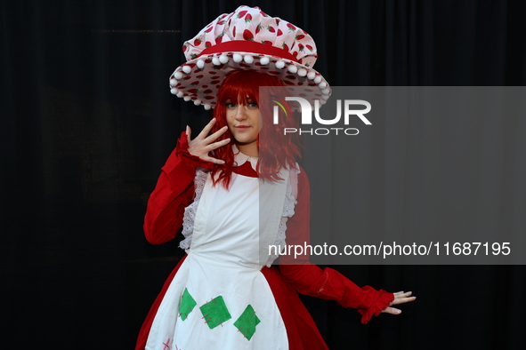 Cosplayer Sophie from New York dresses as Strawberry Shortcake, the 1980 version, for New York Comic Con at the Javits Center in New York Ci...