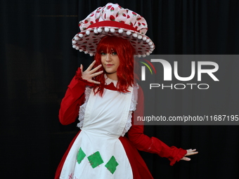 Cosplayer Sophie from New York dresses as Strawberry Shortcake, the 1980 version, for New York Comic Con at the Javits Center in New York Ci...