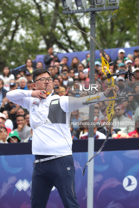 Woojin Kim of Korea competes against Thomas Chirault of France (not in picture) during the Men's recurve quarterfinals match on the final da...