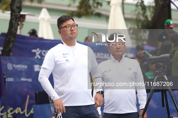 Woojin Kim of Korea competes against Thomas Chirault of France (not in picture) during the Men's recurve quarterfinals match on the final da...