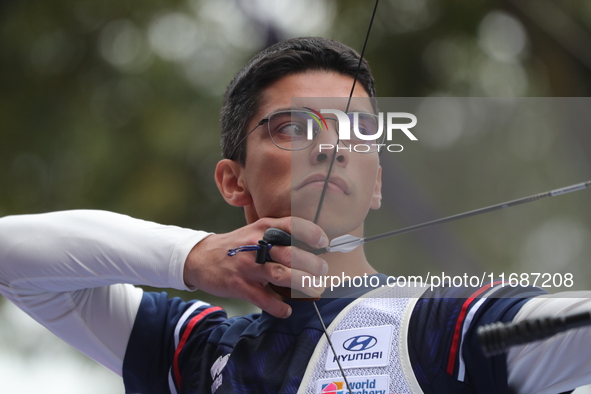 Thomas Chirault of France competes against Woojin Kim of Korea (not in picture) during the Men's recurve quarterfinals match on the final da...