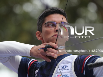 Thomas Chirault of France competes against Woojin Kim of Korea (not in picture) during the Men's recurve quarterfinals match on the final da...