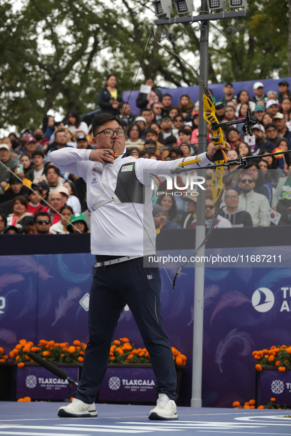 Woojin Kim of Korea competes against Thomas Chirault of France (not in picture) during the Men's recurve quarterfinals match on the final da...