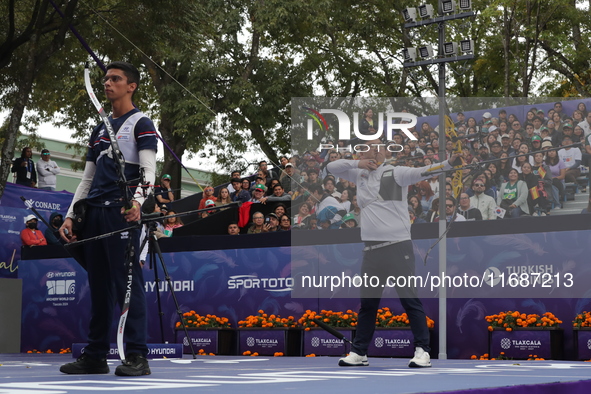 Woojin Kim of Korea and Thomas Chirault of France compete during the Men's recurve quarterfinals match on the final day of the Tlaxcala 2024...