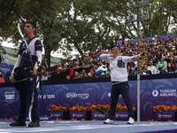 Woojin Kim of Korea and Thomas Chirault of France compete during the Men's recurve quarterfinals match on the final day of the Tlaxcala 2024...