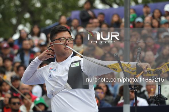 Woojin Kim of Korea competes against Thomas Chirault of France (not in picture) during the Men's recurve quarterfinals match on the final da...