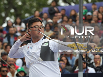 Woojin Kim of Korea competes against Thomas Chirault of France (not in picture) during the Men's recurve quarterfinals match on the final da...