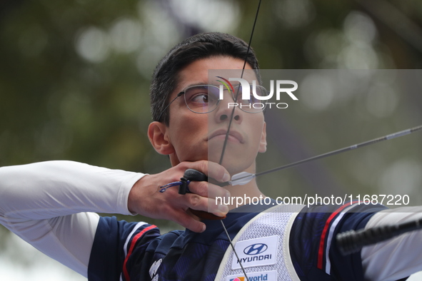 Thomas Chirault of France competes against Woojin Kim of Korea (not in picture) during the Men's recurve quarterfinals match on the final da...