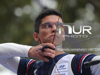 Thomas Chirault of France competes against Woojin Kim of Korea (not in picture) during the Men's recurve quarterfinals match on the final da...