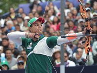 Matias Grande of Mexico competes against Mauro Nespoli of Italy (not in picture) during the Men's recurve quarterfinals match on the final d...