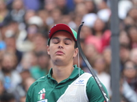 Matias Grande of Mexico competes against Mauro Nespoli of Italy (not in picture) during the Men's recurve quarterfinals match on the final d...