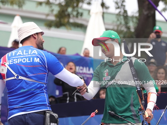 Matias Grande of Mexico and Mauro Nespoli of Italy compete during the Men's recurve quarterfinals match on the final day of the Tlaxcala 202...